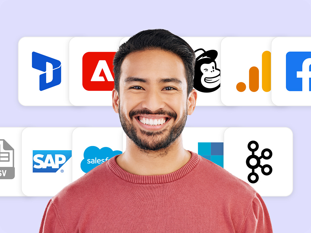 Photo of a smiling person looking directly at the camera. In the background there are several large icons for popular tech platforms including Adobe Campaign, Mailchimp, Google Analytics, Facebook, Salesforce, and more.